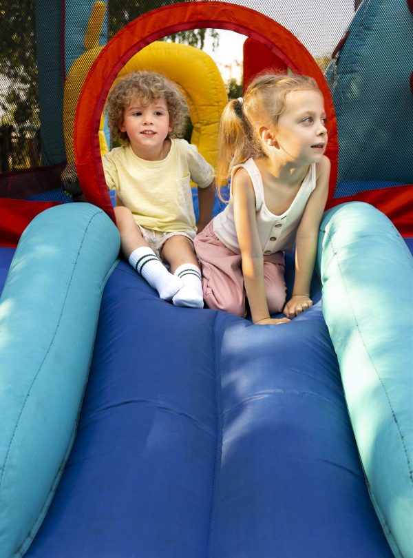 kids-laying-bounce-house-full-shot
